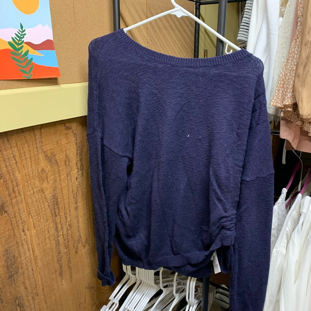 A blue sweater